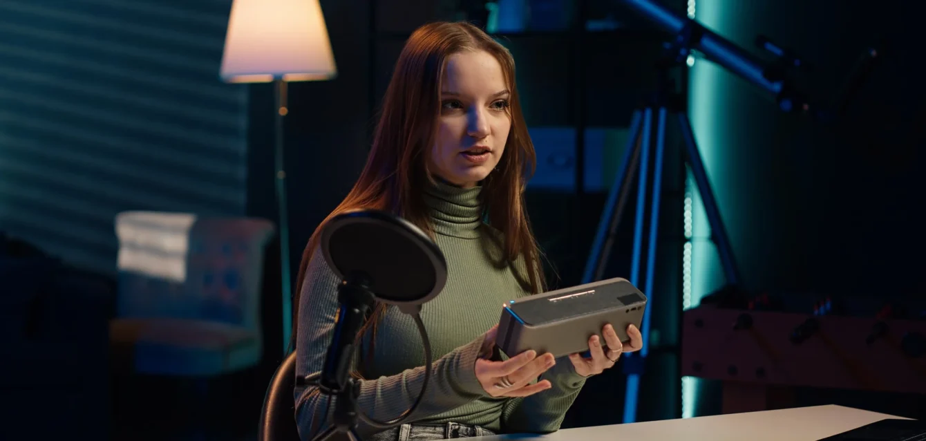 young-content-creator-filming-video-about-bluetooth-speakers-min (1)